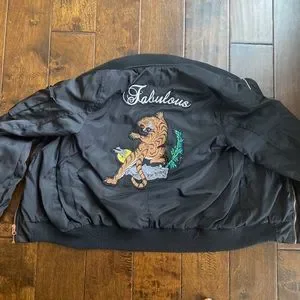 Black bomber jacket with orange in the inside